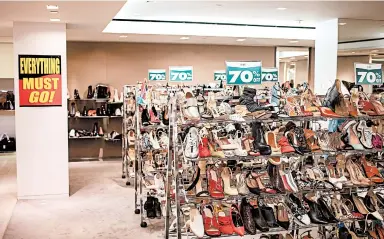  ?? HARUKA SAKAGUCHI/THE NEW YORK TIMES ?? Racks of shoes are shown at a Barneys in Manhattan. Barneys New York filed for bankruptcy last year.