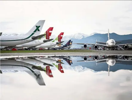  ?? — Photos: LIONEL BONAVENTUR­E/AFP ?? Aeroplanes stocked by Tarmac Aerosave, an aircraft recycling and storage company, in Azereix, southweste­rn France.