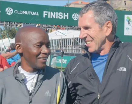  ?? STEPHEN GRANGER ?? RUNNING COMRADES: Thulani Sibisi – who ran yesterday’s Two Oceans Trail Race after surviving cancer – met up with former running mate and ultra athlete Bob de la Motte who rallied support that helped Sibisi receive medical treatment .