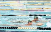  ??  ?? Chad le Clos and Ferlan Petzer, 12, swimming at Kings Park swimming pool in Durban.