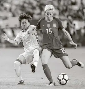  ?? Harry How / Getty Images ?? Megan Rapinoe (15) helped the U.S. women overwhelm Japan 3-0 on Thursday night in the final match of the four-team Tournament of Nations.