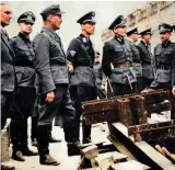  ?? ?? Below: On Hühnlein’s death in 1942, Erwin Kraus took over (centre with peaked cap and NSKK insignia on right upper sleeve). Here he is touring NSKK units in occupied France