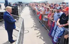  ?? MATT BORN/THE (WILMINGTON, N.C.) STAR NEWS ?? President Donald Trump speaks at Wilmington Internatio­nal Airport in Wilmington, North Carolina, on Wednesday. Trump suggested Thursday that voters go to the polls to check on their mail-in ballots.