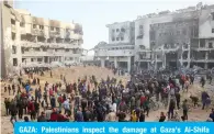  ?? — AFP ?? GAZA: Palestinia­ns inspect the damage at Gaza’s Al-Shifa Hospital after the Zionist military withdrew from the complex on April 1, 2024.