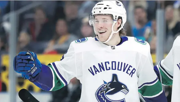  ?? JEFF ROBERSON/THE ASSOCIATED PRESS ?? The Canucks’ Brock Boeser celebrates after scoring a hat trick during the third period against the St. Louis Blues on Sunday in St. Louis.