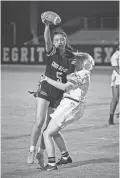  ?? ALEX GOULD/THE REPUBLIC ?? Arizona College Prep running back Regan Burke is defended by Casteel linebacker Olivia Schrempp during a flag football game at Hamilton High School on Sept. 1 in Chandler.