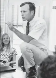  ?? THE ASSOCIATED PRESS ?? In this Oct. 9, 1970 file photo, Rep. George H.W. Bush, R-Texas, talks with a group of young people at a rally in Houston, Texas. Bush died at the age of 94 on Friday, about eight months after the death of his wife, Barbara Bush.