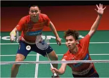  ??  ?? Well done: Aaron Chia (left) and Soh Wooi Yik beat Taiwan’s Lu Ching-yao-Yang Po-han 12-21, 21-16, 21-16 in the first round of the All-England yesterday.