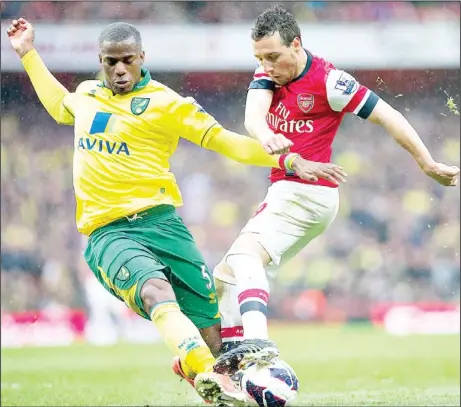  ??  ?? Arsenal’s Santi Cazorla controls the ball in front of Norwich City’s Sebastien Bassong during their English Premier League soccer match at Emirates Stadium, in
London, April 13. (AP)