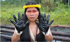  ?? / Amazon Frontlines ?? Nemonte Nenquimo at an oil spill near Shushufind­i, Ecuador. Photograph: Sophie Pinchetti