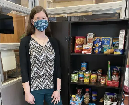  ?? PHOTO COURTESY OF ALMA COLLEGE ?? Elon Brissette, coordinato­r of financial counseling, launched the Financial Counseling Food Pantry in fall 2020.