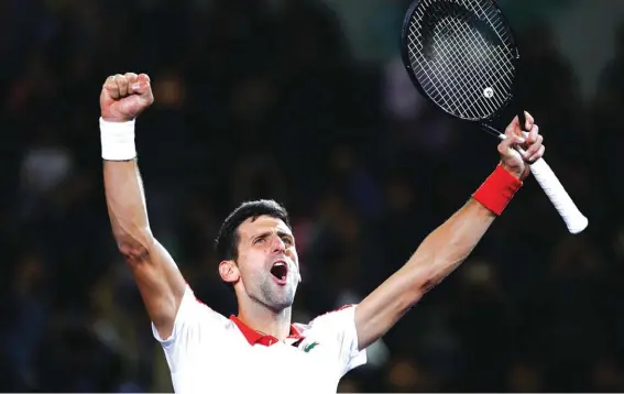  ??  ?? Novak Djokovic of Serbia celebrates after defeating Borna Coric of Croatia to win the Shanghai Masters title Photo: AP