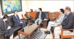  ?? -APP ?? Federal Minister for Planning, Developmen­t & Reform Makhdum Khusro Bakhtyar talking to Ambassador of China Yao Jing. Secretary Planning Zafar Hasan is also present.