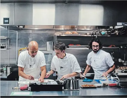  ?? JOHN CULLEN SPECIAL TO THE ST. CATHARINES STANDARD ?? Chefs Daniel Hadida, left, Matt Mason and Eric Robertson in the kitchen at The Restaurant at Pearl Morissette in Jordan. The restaurant was recently named Canada’s Best New Restaurant by enRoute magazine.