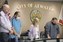  ??  ?? DANNY AMBRIZ is the only person on the dais at an Atwater City Council meeting to wearing a mask, but said he supported the sanctuary city designatio­n.