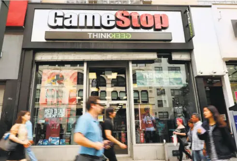  ?? SPENCER PLATT/AFP ?? A GAMESTOP video game retail store in Manhattan, New York. Wall Street financial pundits were stunned by the sharp rise (and subsequent fall) in Gamestop’s stock price, driven by day traders on the Reddit social media site.