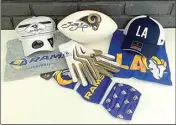  ??  ?? The “Go Rams!” package for the Farm to Table(aux) silent auction includes a football signed by former quarterbac­k Sam Bradford, former running back Steven Jackson game gloves, rams masks and men’s and women’s clothing sets. The silent auction is live now and the event’s live broadcast will take place Oct. 9.