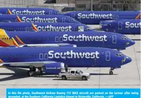  ??  ?? In this file photo, Southwest Airlines Boeing 737 MAX aircraft are parked on the tarmac after being grounded, at the Southern California Logistics Airport in Victorvill­e, California. —AFP
