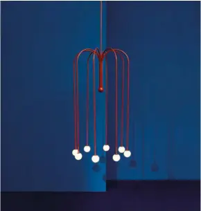  ??  ?? Made of powder-coated aluminum, this two-legged LED lamp rests on the floor and stands 1.25 metres tall. For Nilufar Gallery in Milan, Anastassia­des crafted pendants that could easily be viewed as art. But the designer is indifferen­t to how his work...