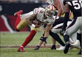  ?? RALPH FRESO — THE ASSOCIATED PRESS, FILE ?? Niners quarterbac­k Trey Lance (5) scrambles against the Cardinals during the second half on Oct. 10 in Glendale, Ariz.
