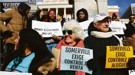  ?? PHOTOS BY JONATHAN WIGGS/GLOBE STAFF ?? Kate Byrne (middle) attended a rally at the Massachuse­tts State House calling for rent control on Tuesday.