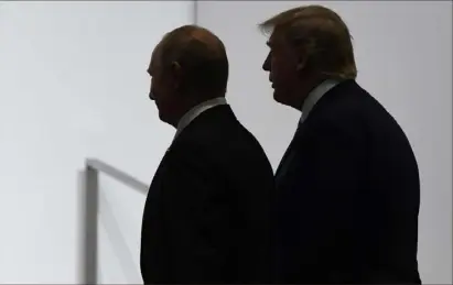  ?? Susan Walsh/Associated Press ?? Russian President Vladimir Putin and then-president Donald Trump at the G20 summit in Osaka, Japan.