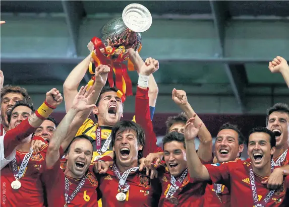  ??  ?? Spain celebrate winning the Euro 2012 title.