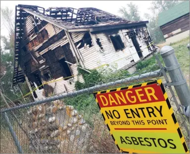  ?? Daily Courier file photo ?? A partial demolition looms for this fire-damaged, city-owned heritage home at the bottom of Dilworth Mountain. While the roof and siding will be removed, the heavy timbers inside the home are worth saving, the city says.