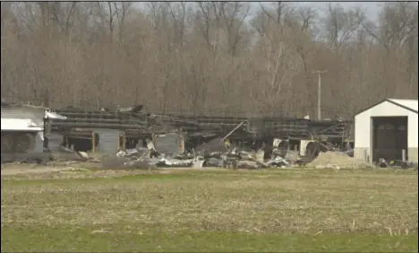  ?? Staff photo/Skyler Mitchell ?? Crews remained on the property of the poultry barn that caught fire Tuesday morning on 33A until 7:50 p.m. Around 75% of the property was damaged.