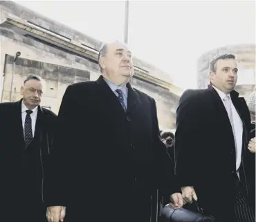  ??  ?? 0 Former first minister Alex Salmond with his legal team outside Edinburgh Sheriff Court