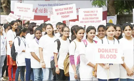  ??  ?? Indian youths hold placards during a rally to raise awareness of blood donation on the occasion of ‘World Blood Donor Day’ in Hyderabad. World Blood
Donor Day is an annual event celebrated around the world on June 14 to raise awareness of the need for...