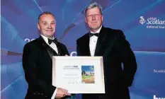  ??  ?? Accolade Douglas Cleeton, left, managing secretary of Blairgowri­e Golf Club receives the award from Malcolm Slumbers, CEO of the R&A