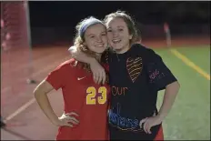  ?? MEDIANEWS GROUP PHOTO ?? Haverford High soccer sisters Paige and Devin Snell embrace on senior night.