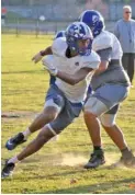  ?? STAFF PHOTO BY PATRICK MACCOON ?? Red Bank senior defensive end Jadon High sprints around a blocker during Tuesday’s practice for this week’s TSSAA Class 3A state semifinal against Alcoa.