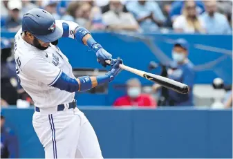  ?? CP ?? Blue Jays’ Lourdes Gurriel Jr. hits a solo home run against the Oakland Athletics on Saturday.