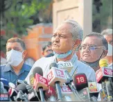  ?? PTI; HIMANSHU VYAS/HT PHOTO ?? Congress MLAS stage a sit-in protest at the Raj Bhavan in Jaipur; chief minister Ashok Gehlot addresses the media in Jaipur on Friday.