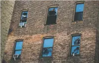  ?? ANDRES KUDACKI/THE ASSOCIATED PRESS ?? Broken windows could be seen Friday on the back of the building where a dozen people died Thursday in a fire in the Bronx borough of New York. The blaze was the city’s deadliest fire in decades.