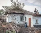  ?? AFP PHOTOS VIA GETTY IMAGES ?? A damaged house is seen Tuesday in Donetsk, Russian-controlled Ukraine, following recent shelling.