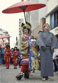  ??  ?? Leng, a 27-year-old Singaporea­n selected to be the first ever foreign oiran, caught the attention of many visitors during the festival. — ANN