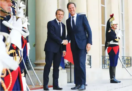  ?? Reuters/File ?? French President Emmanuel Macron welcomes Dutch Prime Minister Mark Rutte at the Elysee Palace in Paris.