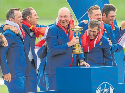  ??  ?? PARIS 2018: European captain Thomas Bjorn with the Ryder Cup after the success at Le Golf National.