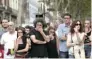  ?? - Reuters ?? IN GRIEF: People react at an impromptu memorial where a van crashed into pedestrian­s at Las Ramblas in Barcelona, Spain, on Saturday.