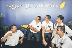  ??  ?? Jet Airways employees sit at the front desk at its headquarte­rs in Mumbai, India, April 18. The carrier, saddled with roughly US$1.2 billion of bank debt, has been teetering for weeks after failing to receive a stop-gap loan of about US$217 million from its lenders, as part of a rescue deal agreed in late March. — Reuters photo