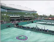  ?? REUTERS ?? Rain suspended quite a few matches on Day 1 of the Wimbledon on Monday.
