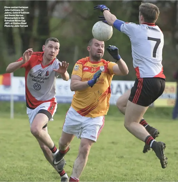  ??  ?? Close contact between John Cullinane (St Johns), Colin O’Sullivan and Daniel Norton (Newmarket) in the Duhallow Nevin Cup JBFL at Station Road Photo by John Tarrant