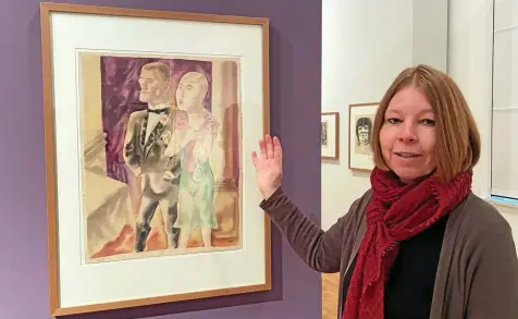  ?? ULRIKE MERKEL ?? Kuratorin Claudia Schönjahn neben dem Titelbild der Geraer Ausstellun­g: George Grosz' „Ehepaar II“von 1925