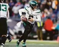  ?? Michael Dwyer / Associated Press ?? New York Jets quarterbac­k Zach Wilson during the second half against the New England Patriots on Sunday in Foxborough, Mass.