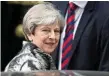  ?? PHOTO: WILL OLIVER/EPA ?? HANGING ON: Theresa May.
