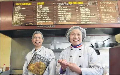  ?? PHOTO: PETER MCINTOSH ?? What a team . . . Big Valley Takeaway owners She Chun Choie and his wife Emma have sold their Kaikorai Valley business after 36 years.