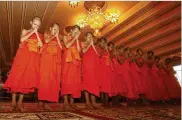  ?? SAKCHAI LALIT / AP ?? Members of the Wild Boars soccer team pray during a ceremony marking the completion of serving as novice Buddhist monks, after their rescue from a cave in which they were trapped for nearly three weeks.